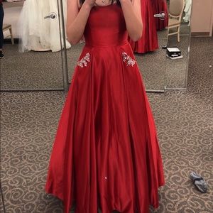 Strapless red prom dress with pockets
